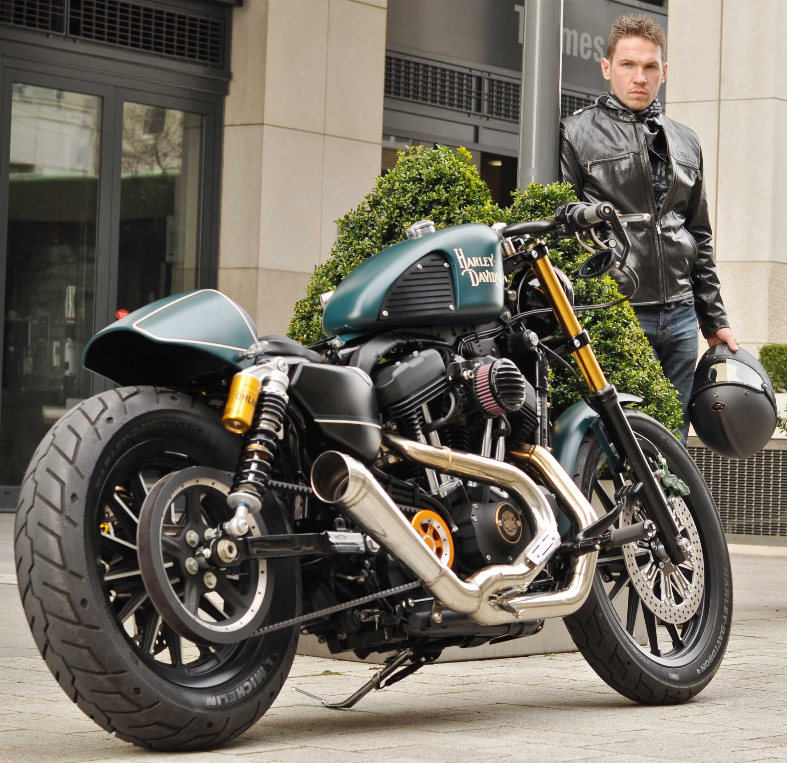 Project bike parked outside with Charlie Stockwell of Warr's in the backgroun