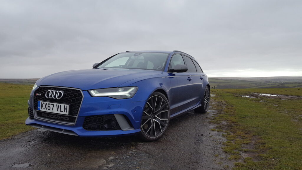 Blue RS6 on an overcast day with hills in the background