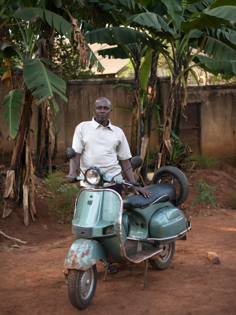 A green Vespa shines in Africa.