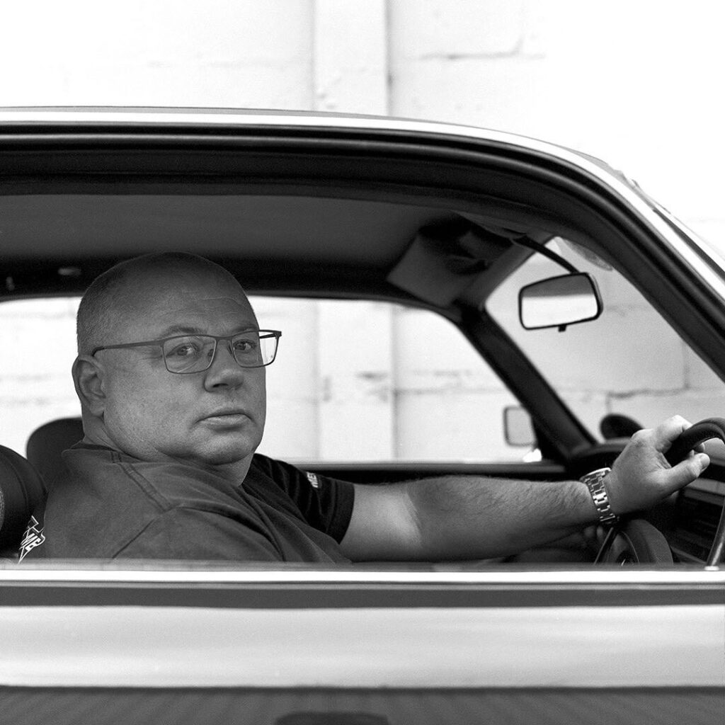 Charles Evans behind the wheel