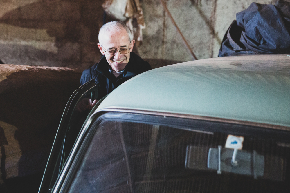 Aubone getting into one his Ford Anglias with a smile on his face